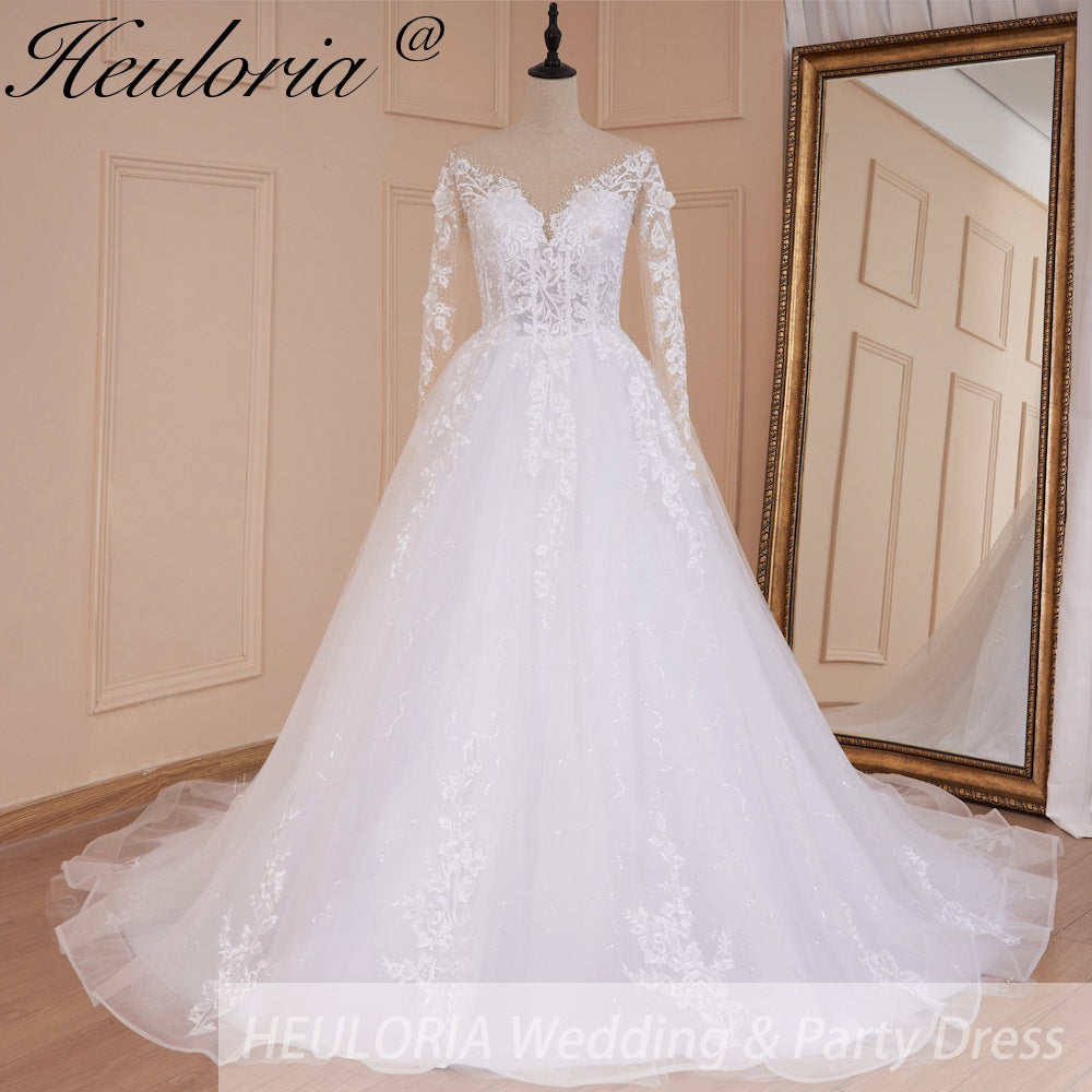 HEULORIA Illusion V-Neck Long Sleeve Lace Wedding Dress with 3D Floral Appliques & Shimmering A-Line Skirt AL-559 plus