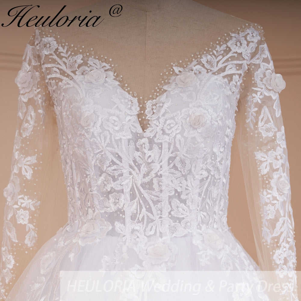 HEULORIA Illusion V-Neck Long Sleeve Lace Wedding Dress with 3D Floral Appliques & Shimmering A-Line Skirt AL-559 plus