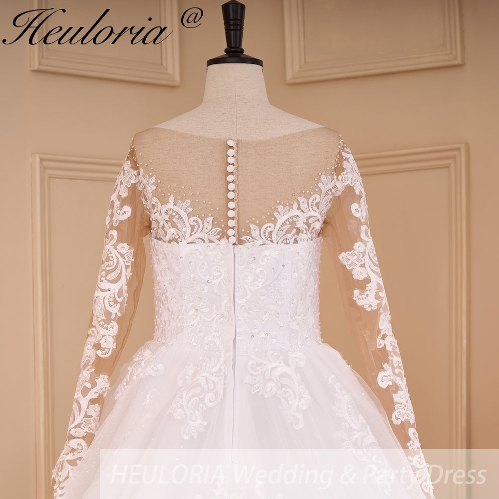 HEULORIA Elegant Illusion Long Sleeve Ball Gown Wedding Dress with Pearl Beaded Neckline and Lace Cathedral Train BA-778A