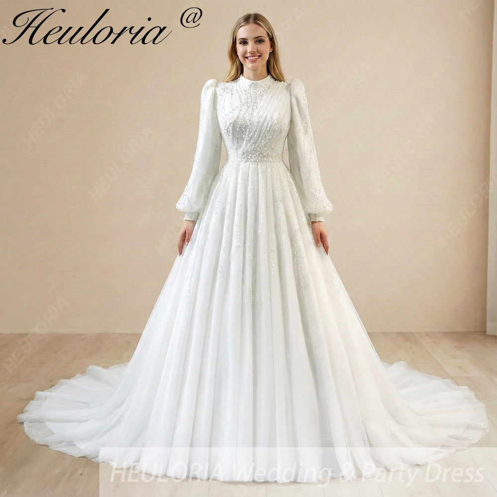 HEULORIA Regal High-Neck Beaded Wedding Dress: Sparkling Sequin A-Line Gown with Bishop Sleeves Muslim wedding dress  BA-1205 Image principale du produit
