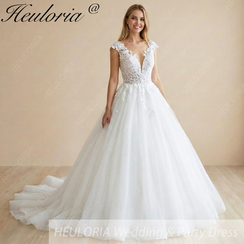 HEULORIA Enchanted Radiance: Plunging Illusion V-Neck Ball Gown Wedding Dress with Delicate Cap Sleeves BA-1075