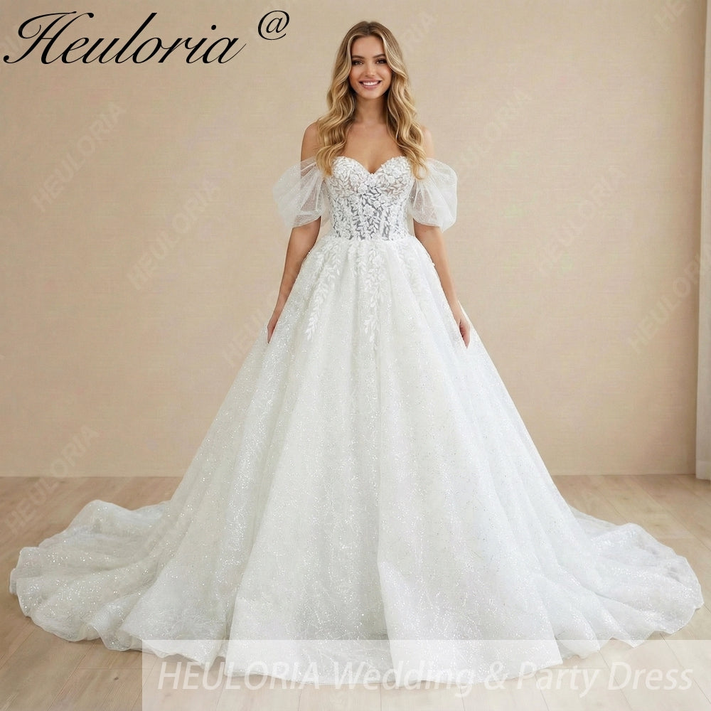 HEULORIA Sparkly Off-the-Shoulder Puff Sleeve Wedding Dress – Shimmering Lace Sweetheart Ball Gown BA-1076 Immagine principale del prodotto
