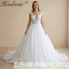 HEULORIA Enchanted Radiance: Plunging Illusion V-Neck Ball Gown Wedding Dress with Delicate Cap Sleeves BA-1075