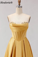 HEULORIA Strapless Golden Satin Ball Gown with Beaded Corset Bodice and Pleated Skirt ED-516