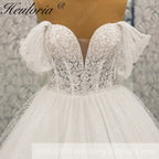 HEULORIA Enchanting Off-the-Shoulder Glitter Tulle Wedding Dress with Dramatic Puff Sleeves & Plunging Sweetheart Neckline BA-1062