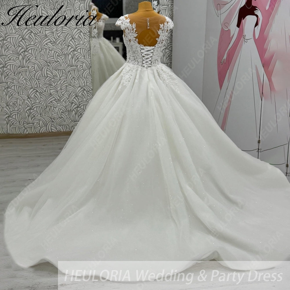 HEULORIA Enchanted Radiance: Plunging Illusion V-Neck Ball Gown Wedding Dress with Delicate Cap Sleeves BA-1075