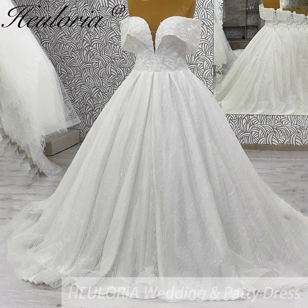 HEULORIA Shimmering Floral Lace Off-the-Shoulder Ball Gown Wedding Dress with Plunging Illusion V-Neck BA-1108